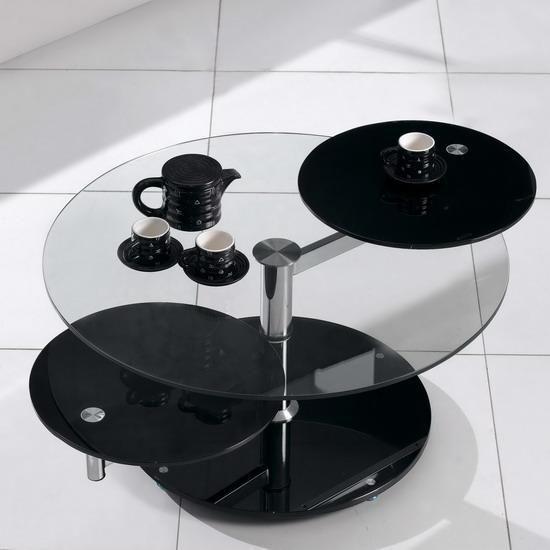 Rotating Glass Coffee Table Also Glass Material Increases The Space Of All Rooms (View 1 of 9)