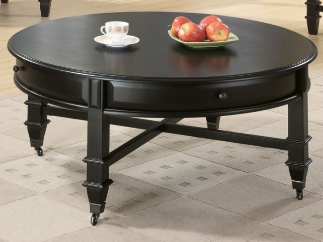 Round Coffee Tables With Drawers Round Black Elegant Stained Wooden Coffee Table 4 Legs White Cup And Apple Fruit (View 7 of 10)
