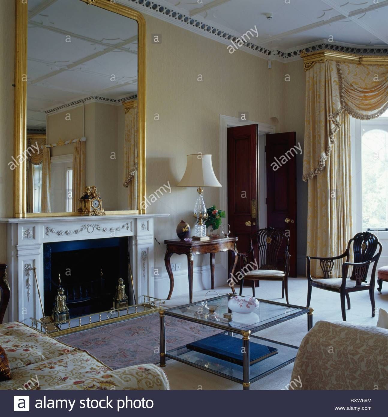 Large Antique Gilt Mirror Above Ornate Fireplace In Living Room With Regard To Large Gilt Mirrors (View 22 of 25)