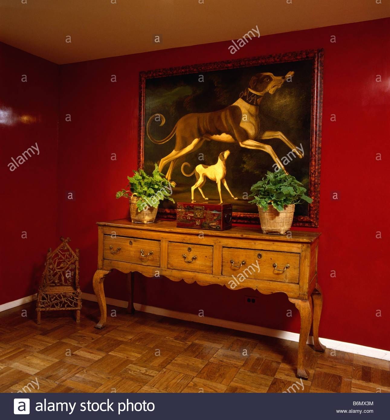 Large Oil Painting Of Dogs Above Antique Sideboard In Red Hall Pertaining To Hall Sideboards (View 30 of 30)