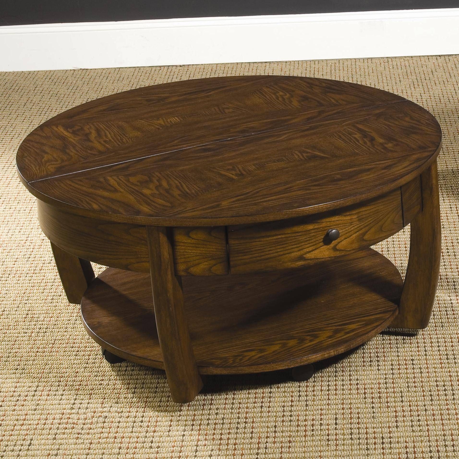 Round Lift Top Cocktail Table With Lower Shelf And Drawer Within Round Coffee Tables With Drawers (View 8 of 30)