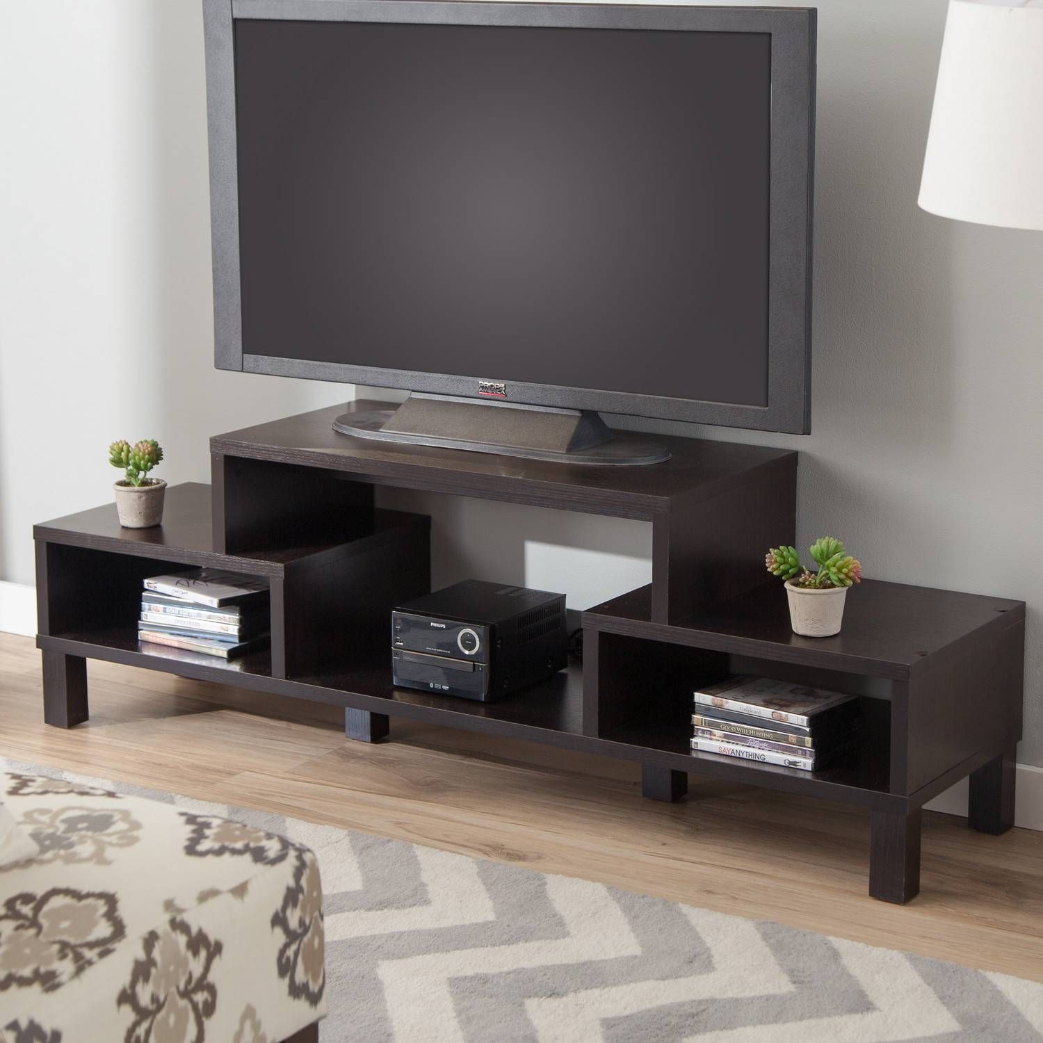 Big Led Tv On Unusual Tv Stands With Cute Flower Vase Above Books Throughout Led Tv Cabinets (View 14 of 15)