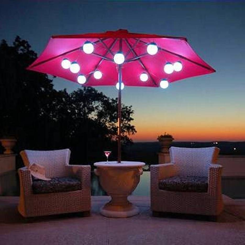 Patio Umbrella Marquee Lights White Wicker Chair Scene At Night Inside Outdoor Umbrella Lanterns (View 3 of 20)