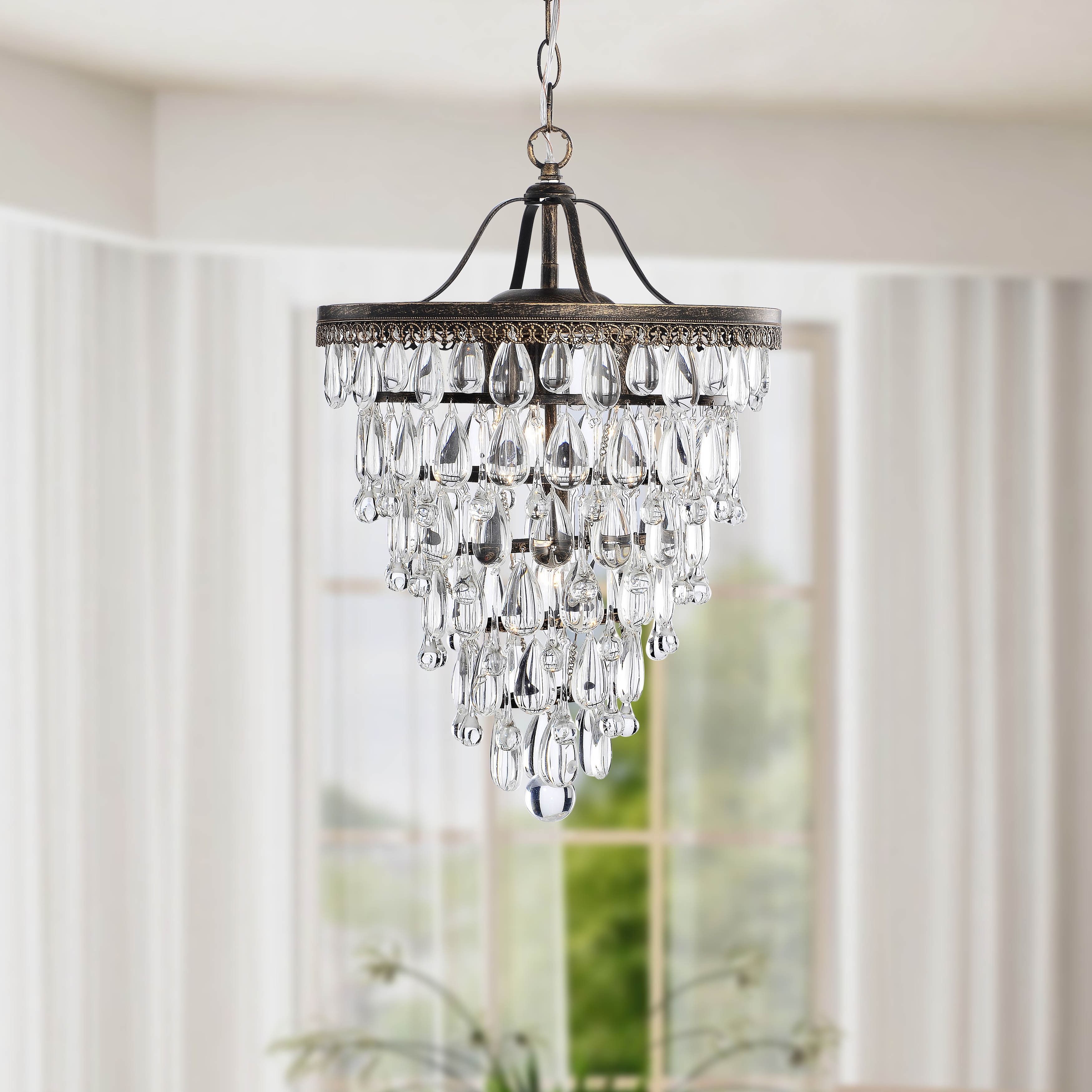 Give Your Home An Elegant Makeover With This Four Light Throughout Verdell 5 Light Crystal Chandeliers (View 16 of 30)
