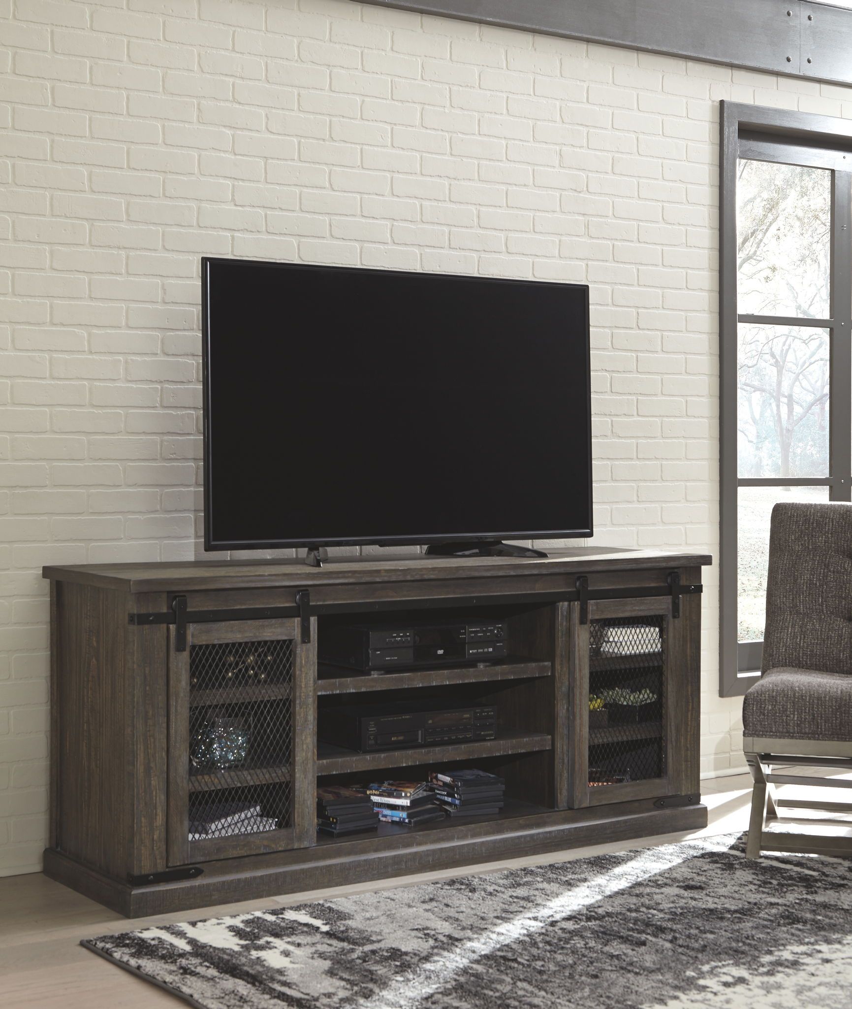 Danell Ridge – Brown – Extra Large Tv Stand | Furniture Within Kado Corner Metal Mesh Doors Tv Stands (View 10 of 15)