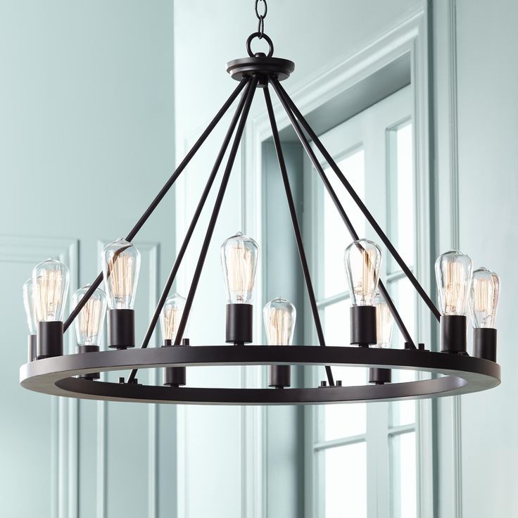 Lacey 28" Wide Round Black 12 Light Led Wagon Wheel Regarding Black Wagon Wheel Ring Chandeliers (View 6 of 15)