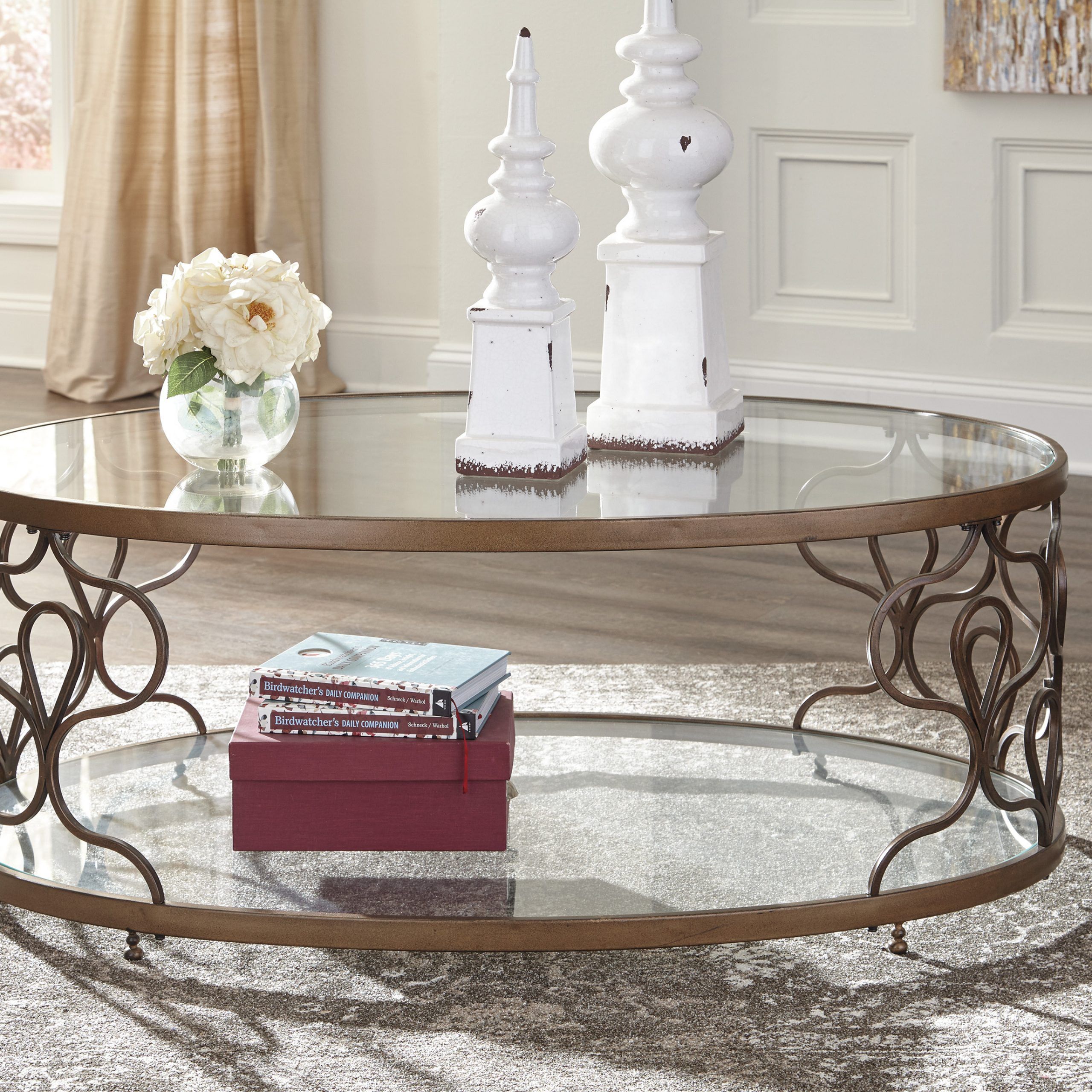 Ashley Furniture Fraloni Bronze Finish Oval Metal Coffee With Espresso Wood And Glass Top Coffee Tables (View 2 of 15)