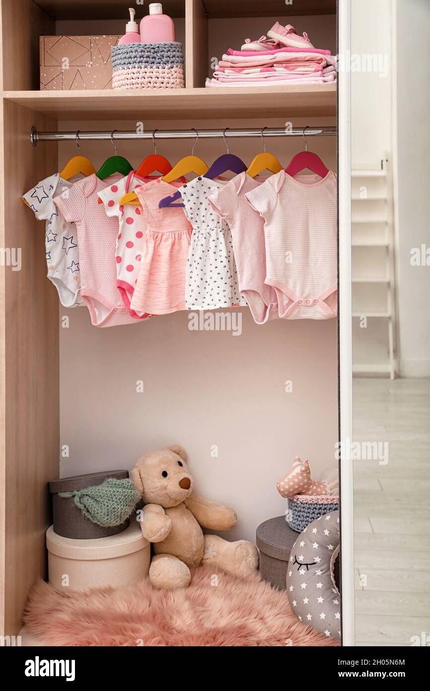 Wardrobe With Cute Baby Clothes And Toys Stock Photo – Alamy Pertaining To Wardrobe For Baby Clothes (View 14 of 15)